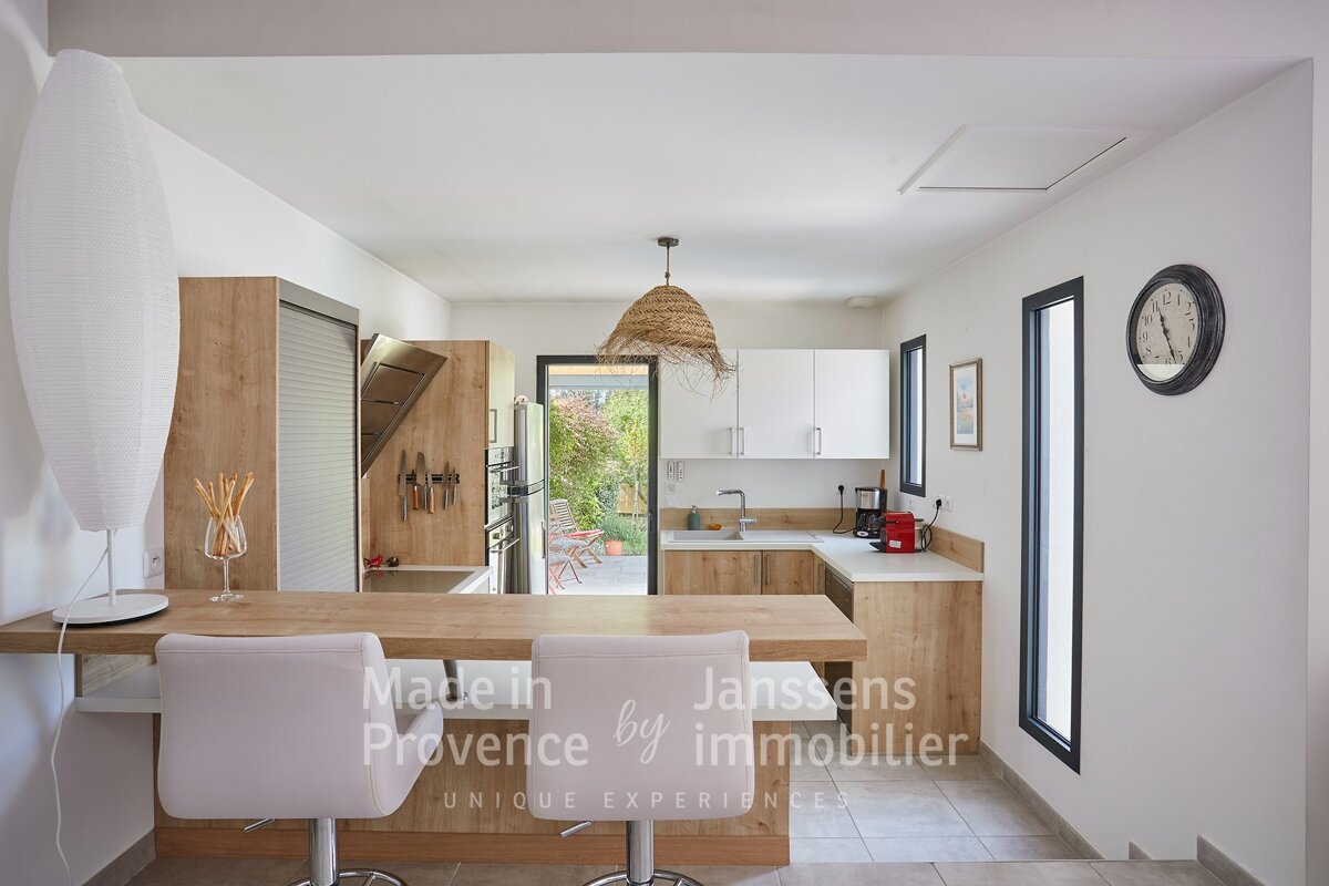 A kitchen with the words made in provence by immobilier
