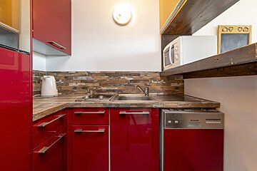 A living room with a wooden table and chairs