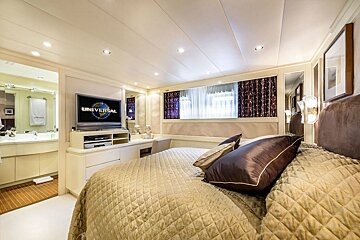 A bedroom with a tv that says universal on it