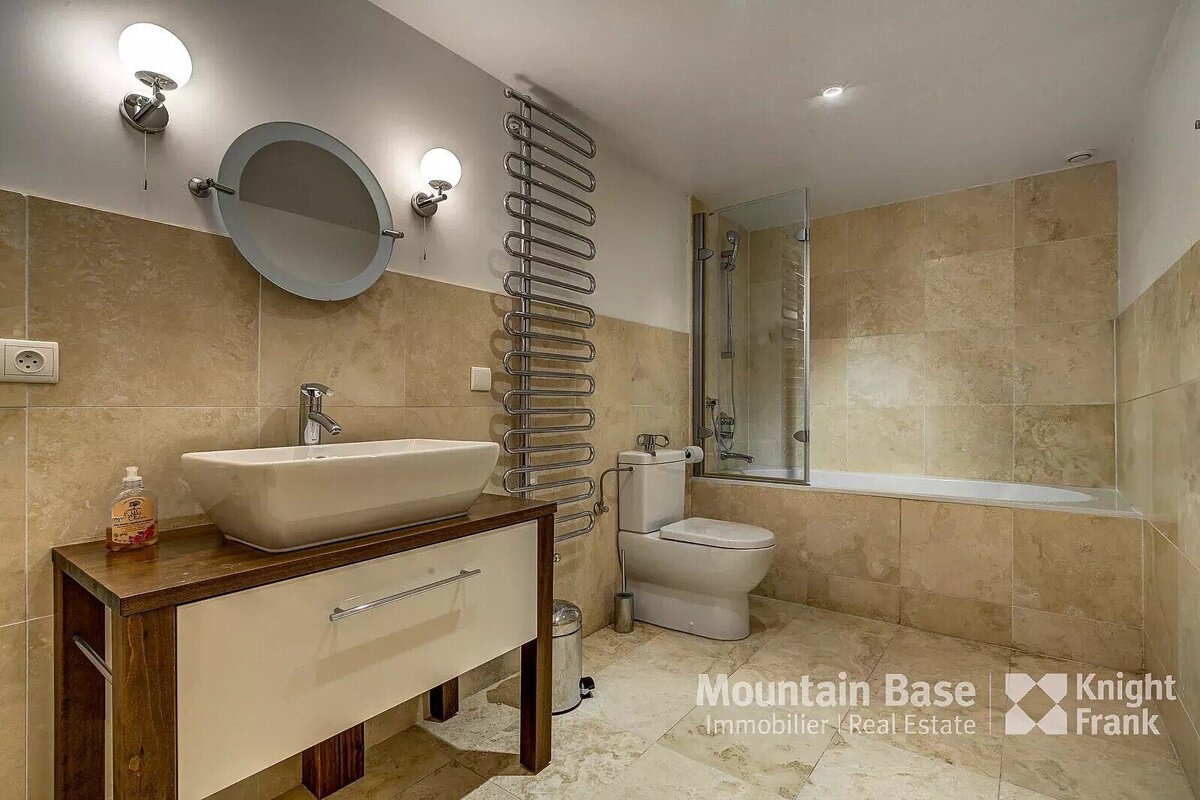 A bathroom with a knight frank logo on the bottom