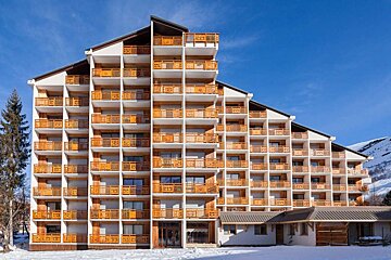 A large building with a lot of balconies and windows