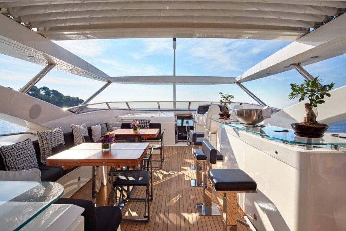 The inside of a boat with tables and chairs