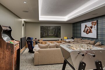 A game room with a picture of a bear on the wall