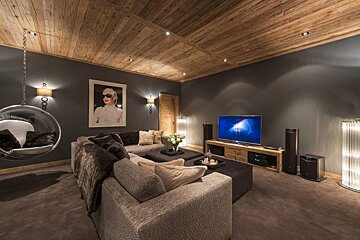 A living room with a couch and a television