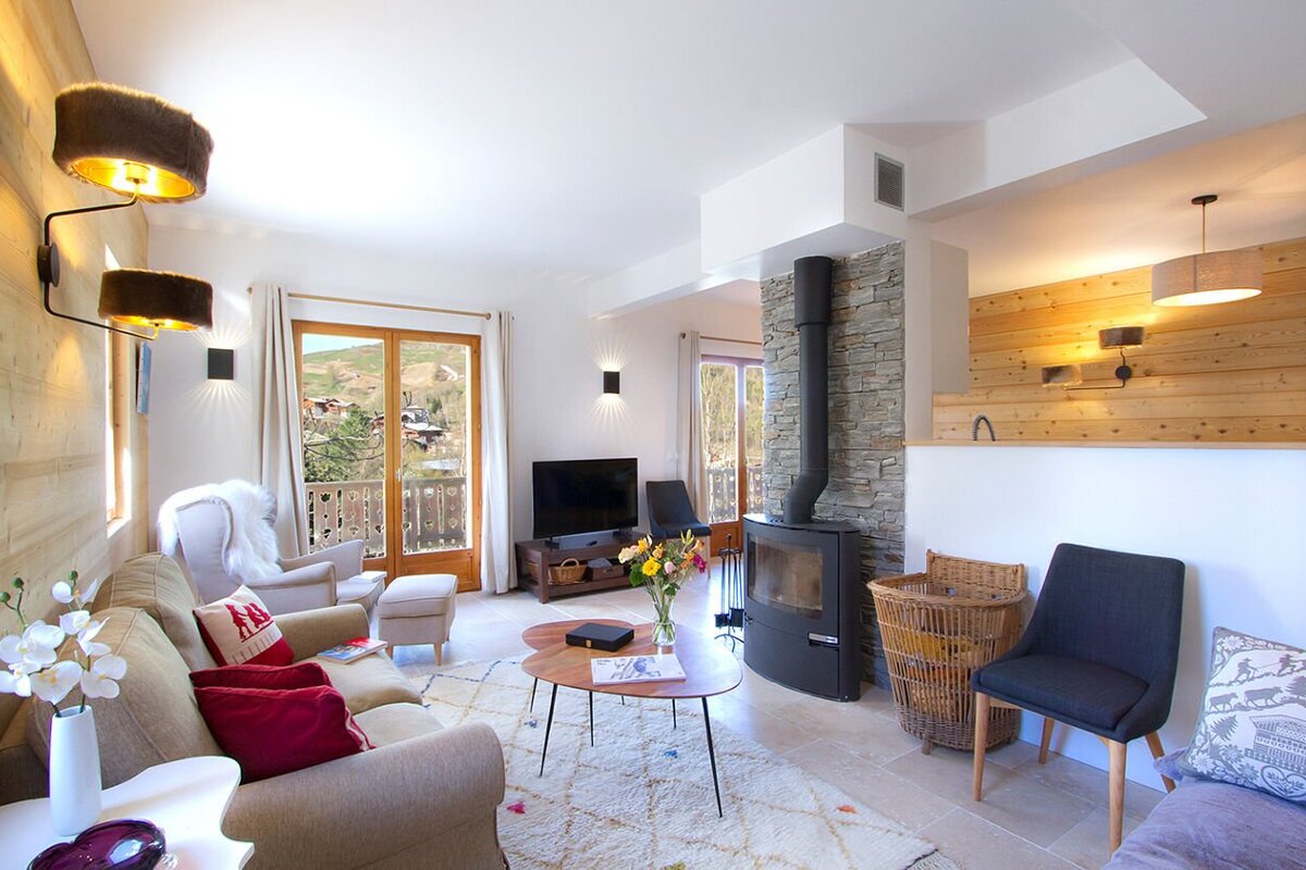 A living room with a fireplace and a flat screen tv