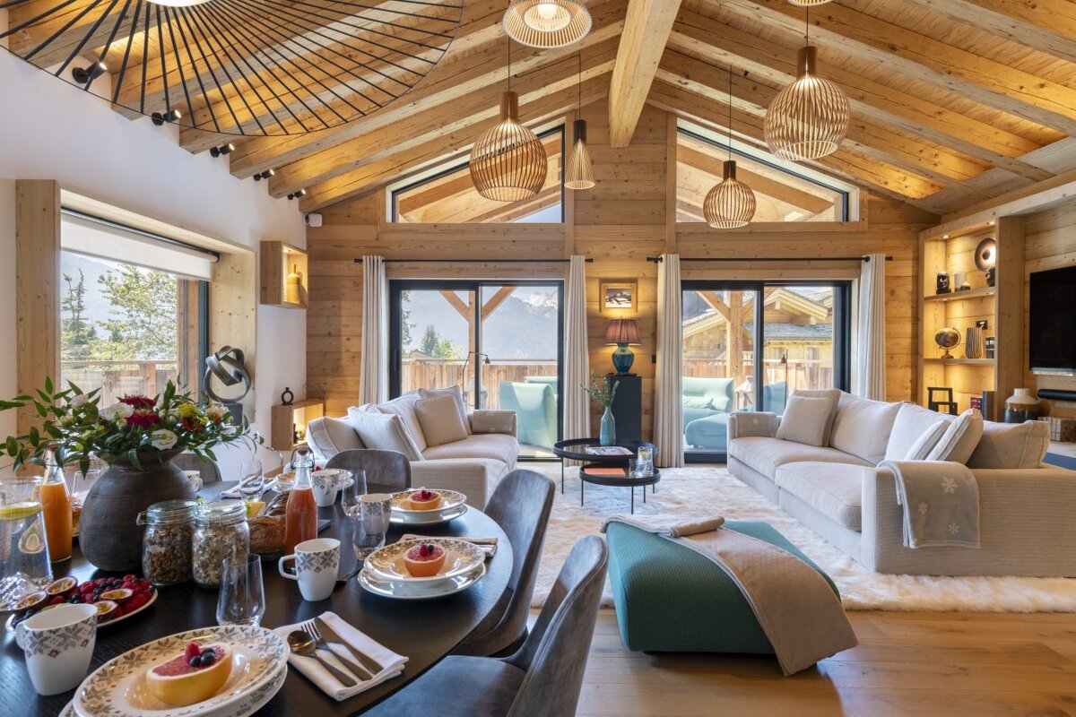 A living room with a dining table and a couch