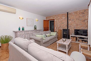 A living room with a couch and a television