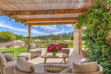 A patio with a table and chairs and a sign that says made in france