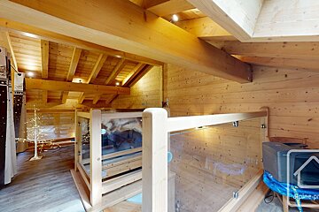 A picture of a wooden house with the word alpine on it