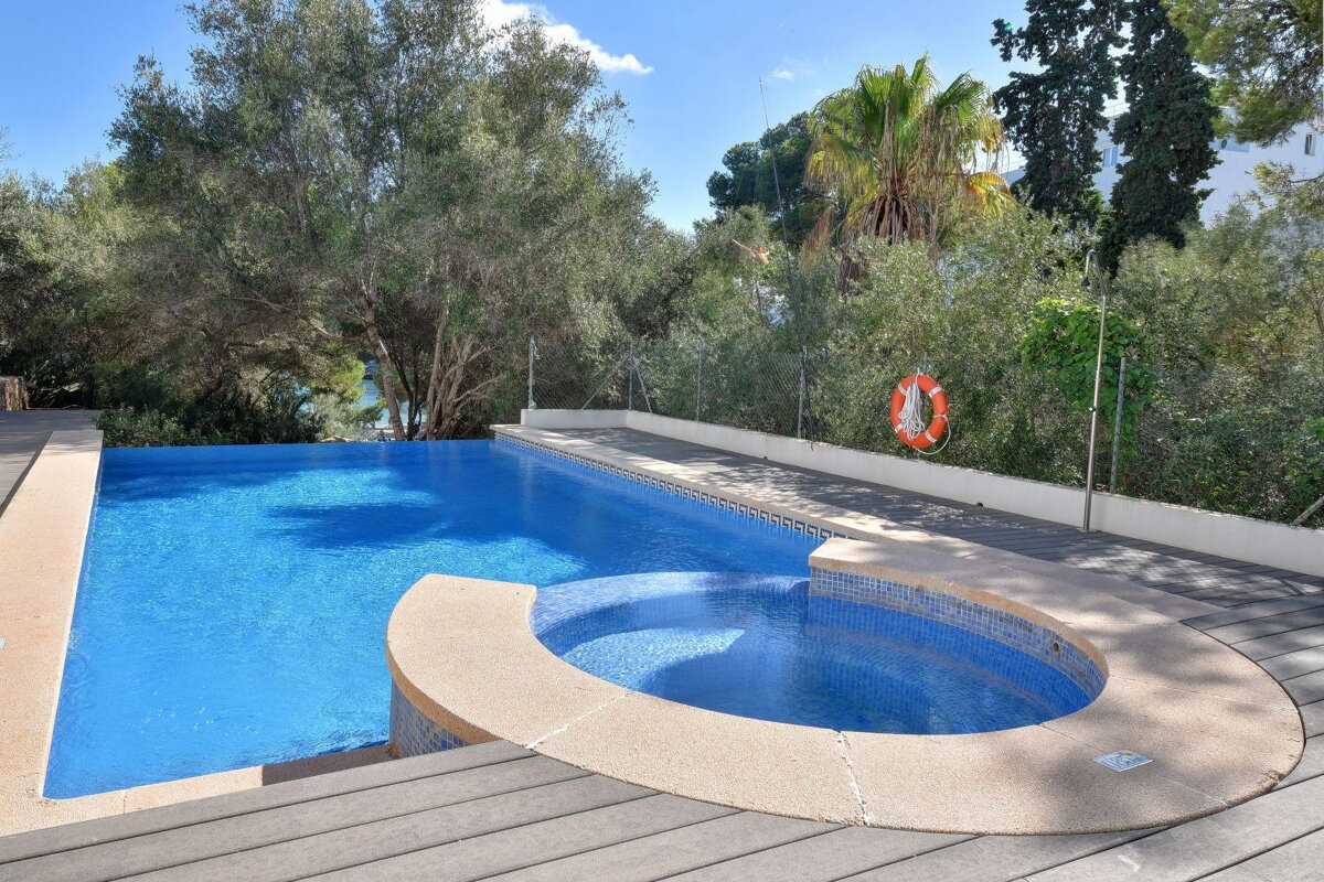 A swimming pool with a life preserver on the side
