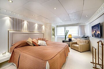 A bedroom with a paramount picture on the wall