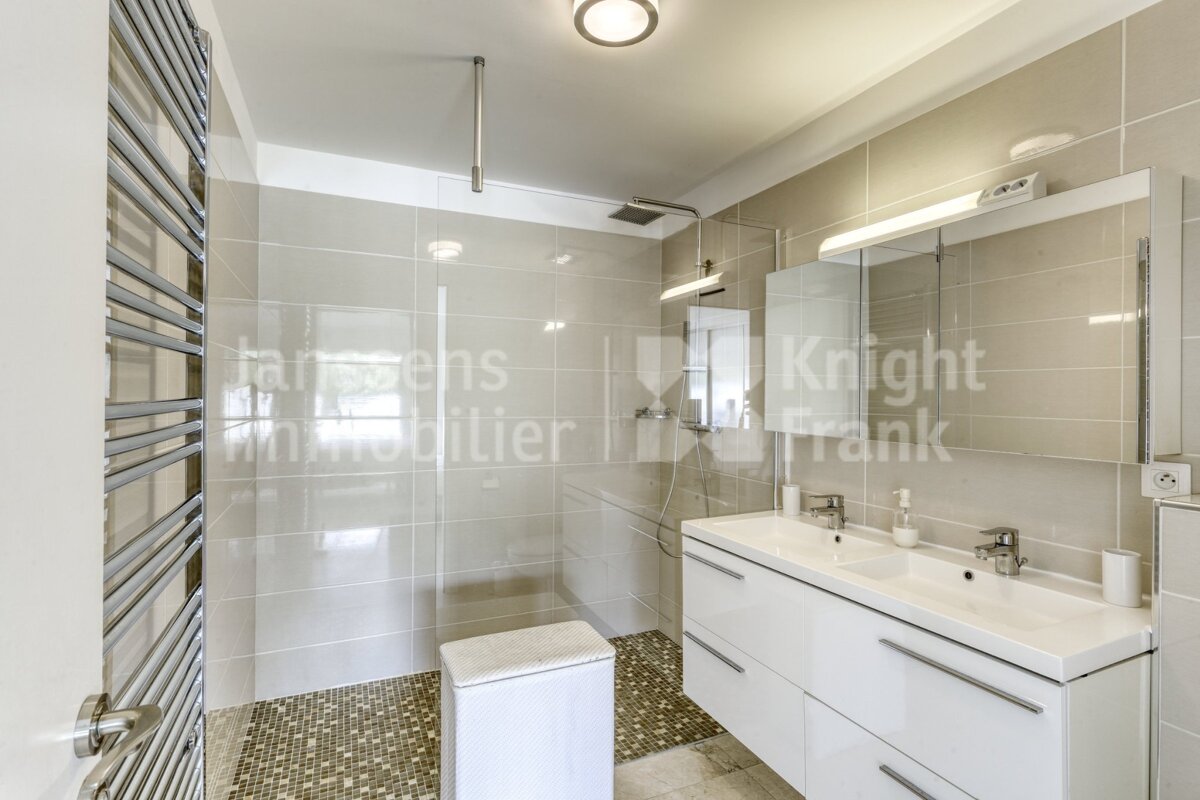 A bathroom with knight frank written on the wall