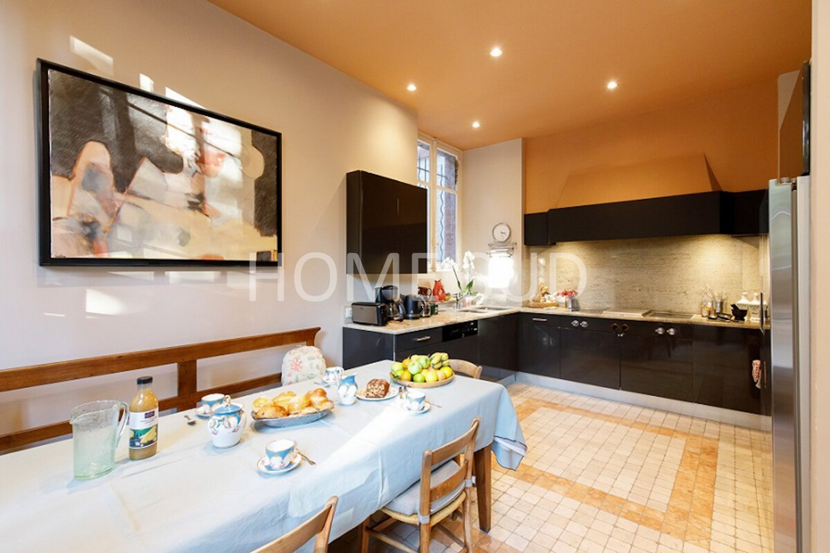 A kitchen with the word home on the ceiling