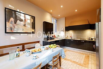 A kitchen with the word home on the ceiling