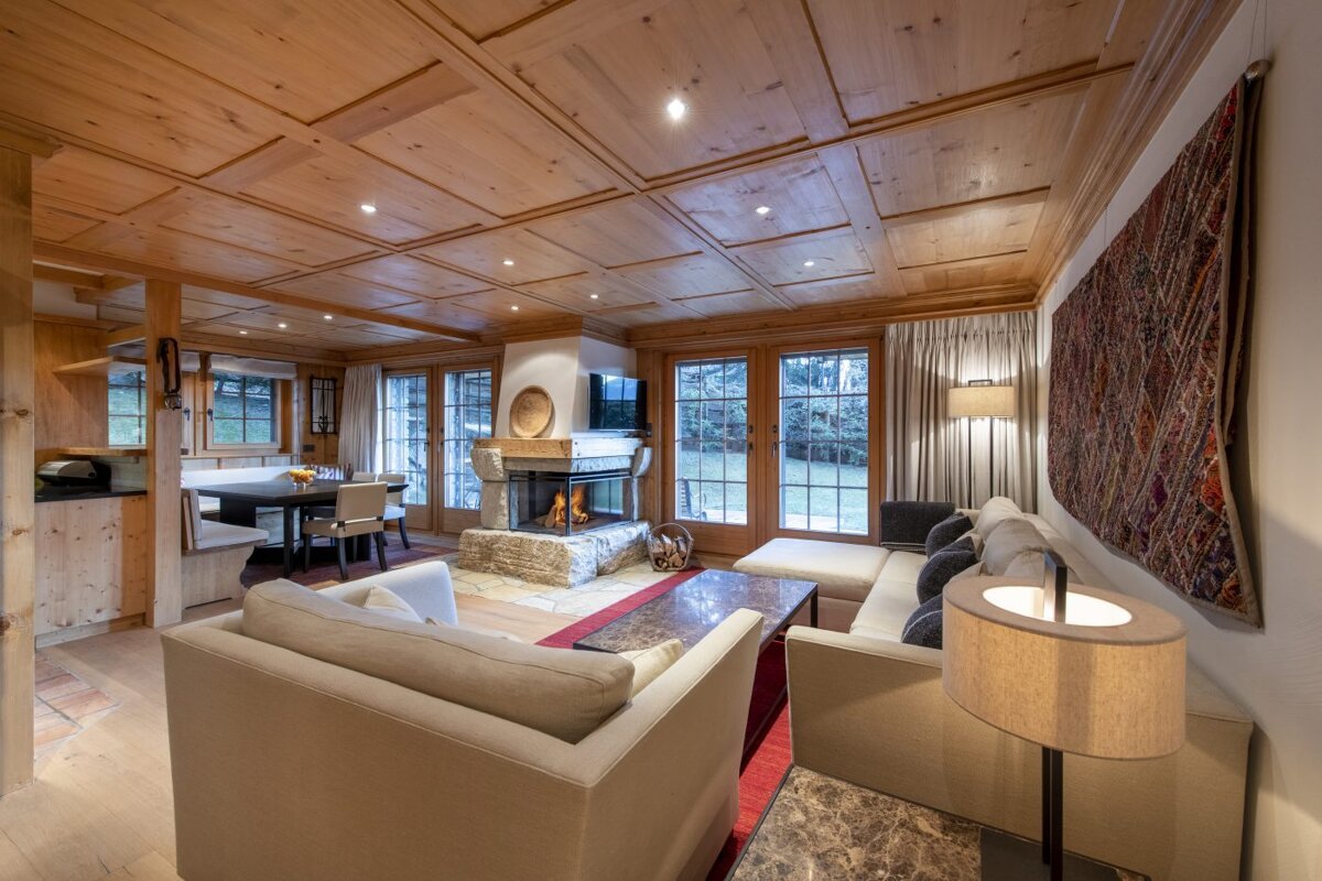 A living room with a fireplace and a couch