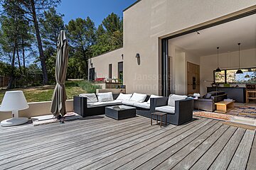 A large sliding glass door opens to a living room