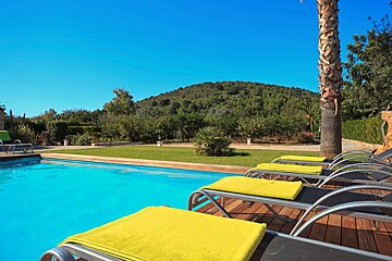 A swimming pool with a mountain in the background