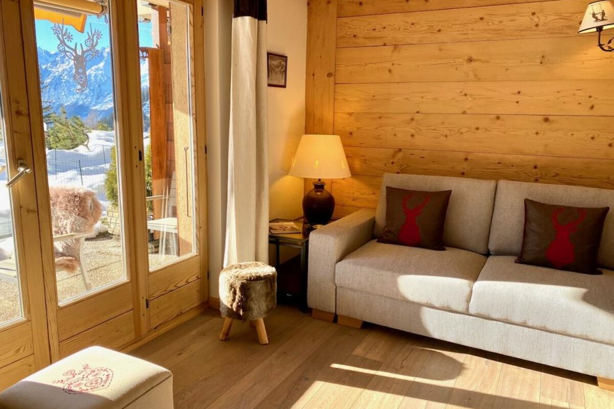 A living room with a couch and a lamp