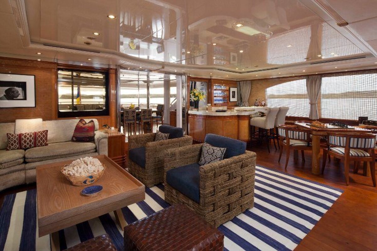 A living room with a striped rug and a couch