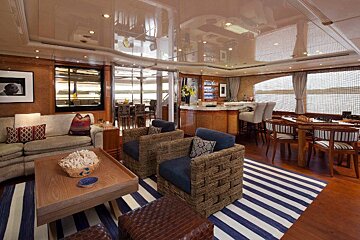 A living room with a striped rug and a couch