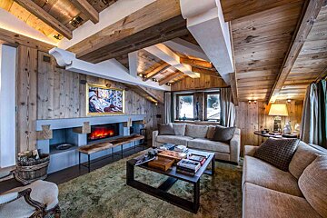 A living room with a fireplace and a couch