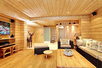 A living room with a couch that has a pillow that says