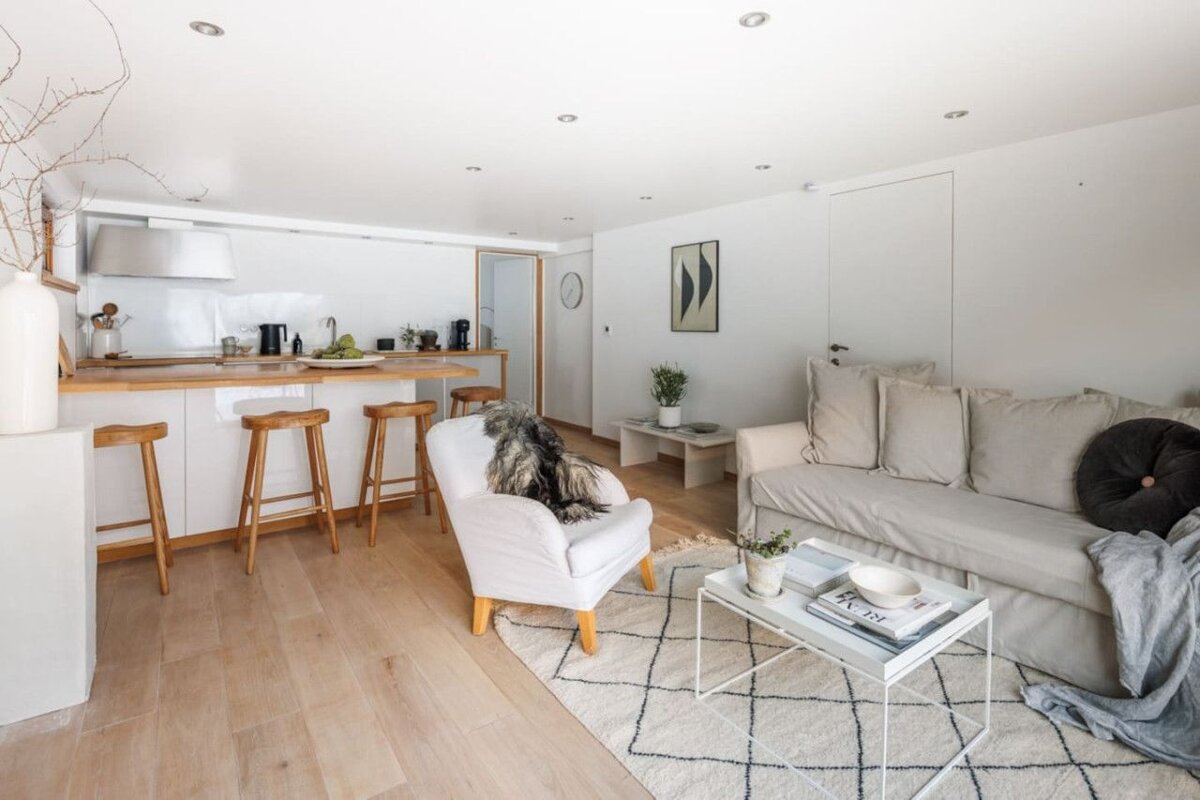 A living room with a couch a chair and a coffee table