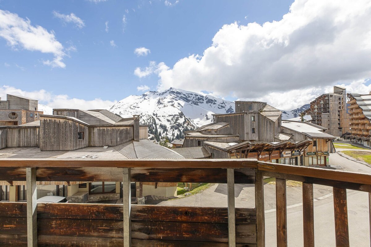 A view of a snowy mountain from a balcony