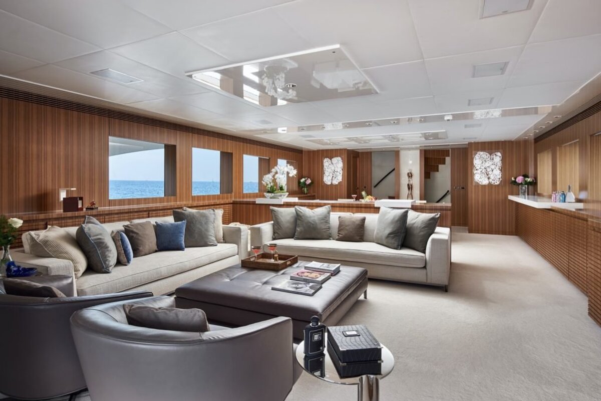 A living room with a couch and two chairs