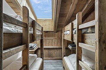 A bathroom with a sink and a walk in shower