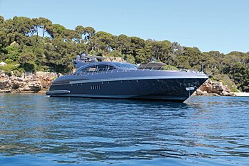 A large yacht is floating on a body of water