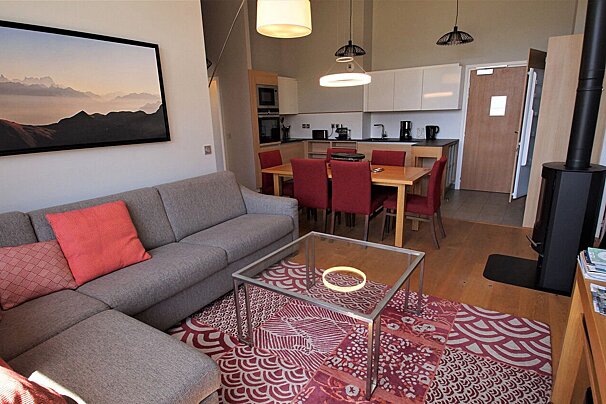 A living room with a couch and a table