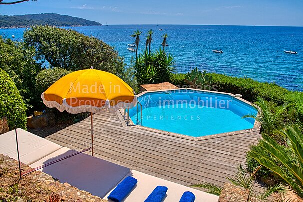 A swimming pool with the words made in provence immobilier on the bottom