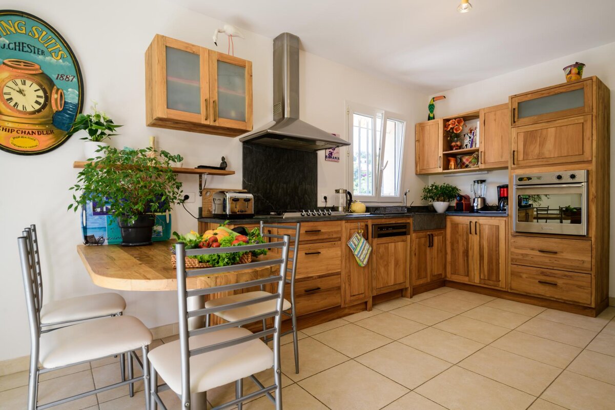 A kitchen with wooden cabinets and a sign that says ' chester ' on it