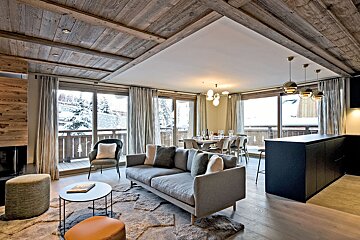 A living room with a couch and a table