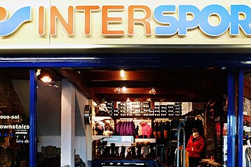 A store front with a sign that says ' intersport ' on it