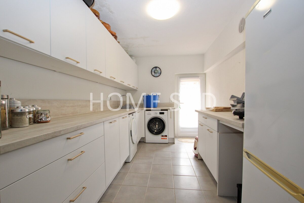 A kitchen with the word home on the counter