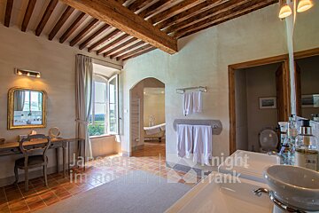 A bathroom with a knight frank logo on the wall