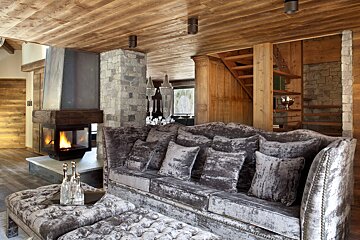 A living room with a couch and a fireplace
