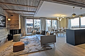 A living room with a couch and a fireplace