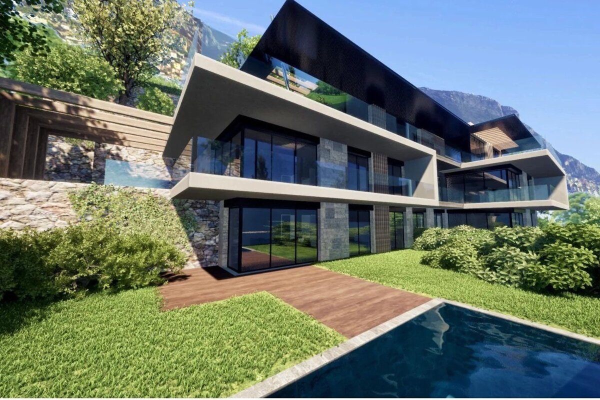 Modern multi-level luxury villa with a pool, glass walls, and a green yard under a bright blue sky.