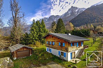 A house with blue shutters is for sale by alpine property
