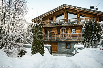 A large wooden house with the word holidays on the front