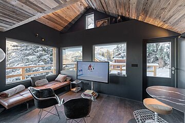 A living room with a flat screen tv on a stand