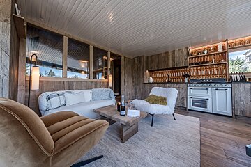 A living room with a couch a chair and a coffee table