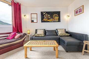A living room with a couch and a table