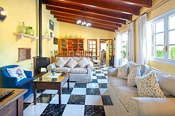 A living room with a checkered floor and a couch