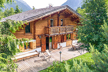 A snowy cabin with a red warning sign on the door