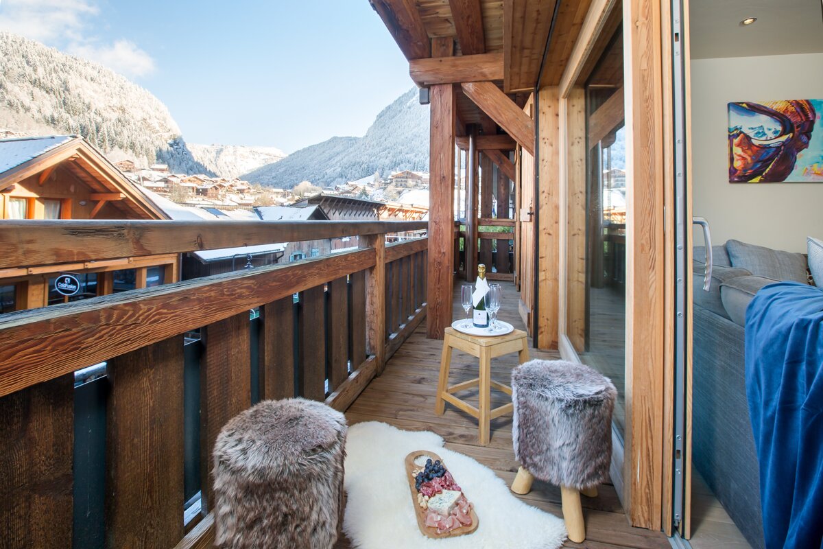 A balcony with a bottle of champagne on it