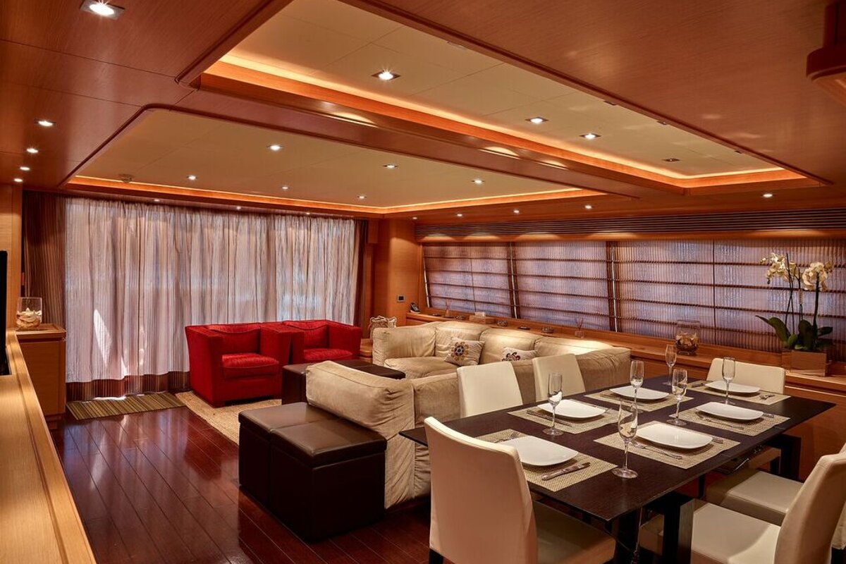 A living room with a dining table and chairs